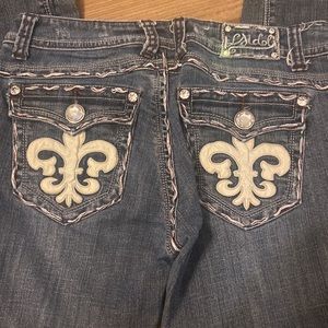 Fleur de Lis and embellished blue jeans